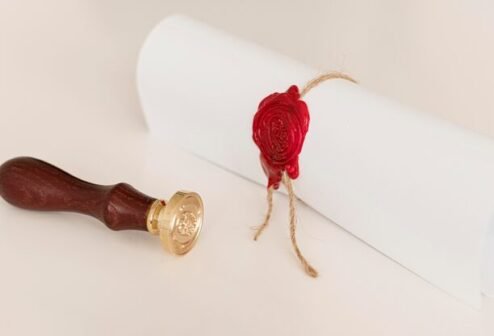 graduation-diploma-certificate-with-ribbon-bow_23-2148769718